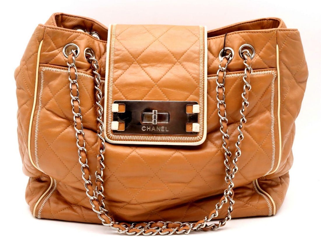 Chanel "East West" Quilted Brown Leather Tote Bag: Chanel "East West" Quilted Brown Leather Tote Bag Measurements: 13 1/2" W x 8 1/4" H x 6 1/2" D Brown quilted leather tote in the “East West” silhouette, featuring a st