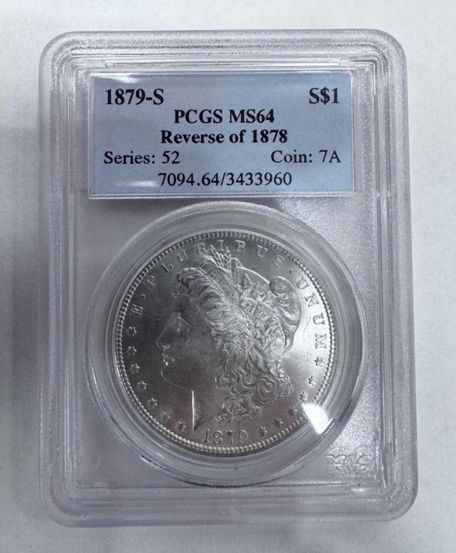 1879-S Morgan Silver Dollar Reverse of 1878 PCGS MS64: 1879-S Morgan Silver Dollar Reverse of 1878 PCGS MS64 Certified by Professional Coin Grading Service (PCGS) as Mint State 64. The desirable Reverse of 1878 variety features the earlier reverse hub des