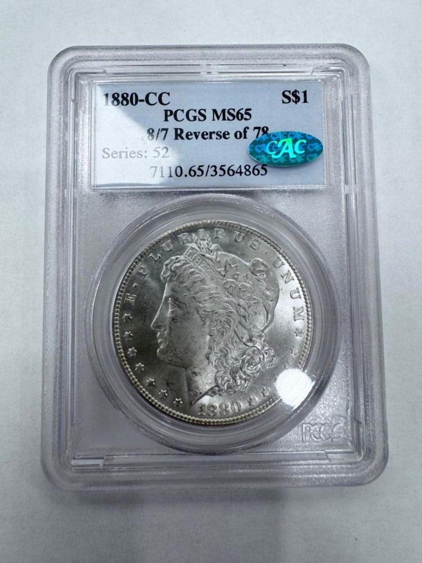 1880-CC Morgan Silver Dollar Reverse of 1878 PCGS MS65: 1880-CC Morgan Silver Dollar Reverse of 1878 PCGS MS65 Certified by Professional Coin Grading Service (PCGS) as Mint State 65. Carson City mint issue featuring the desirable Reverse of 1878 variety. T