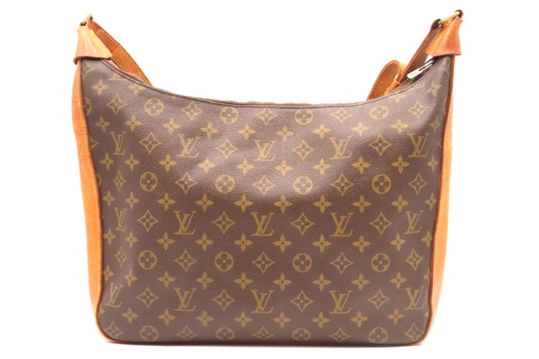 Vintage Louis Vuitton Monogram Canvas Handbag: Louis Vuitton Monogram Canvas Handbag French 20th Century 3 1/2" H x 14" L x 3 1/2" D A vintage Louis Vuitton handbag crafted in the maison’s signature monogram canvas, featuring a s
