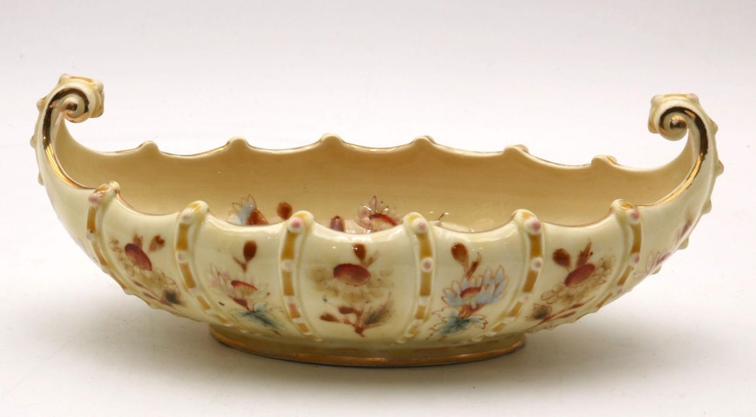 Zsolnay Hungarian Hand Painted Porcelain Bowl: Zsolnay Hand Painted Porcelain Bowl Hungarian 20th Century 3 1/2" H x 9 1/4" L A Hungarian hand painted porcelain bowl by Zsolnay, featuring decorative detailing and marked with the castle