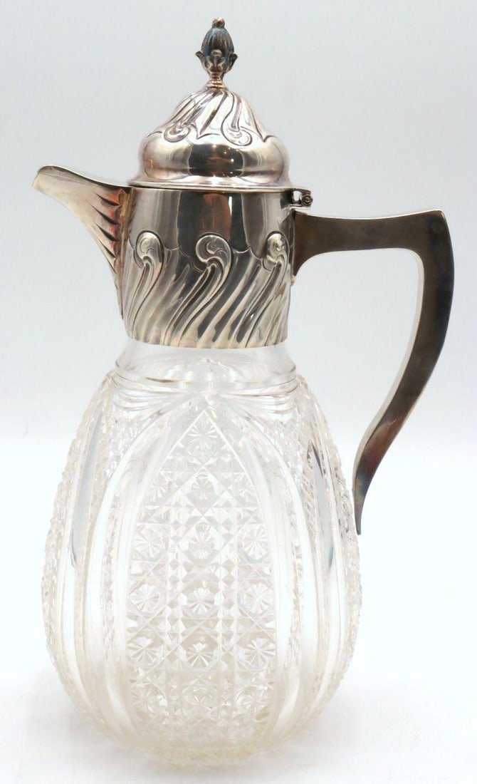 Antique English Sterling Silver & Crystal Claret Jug: Antique English Sterling Silver & Crystal Claret Jug. With intricate flower cross pattern cut and sterling silver top piece stamped "& Co Ltd." with a lion, a "Y" and an anchor