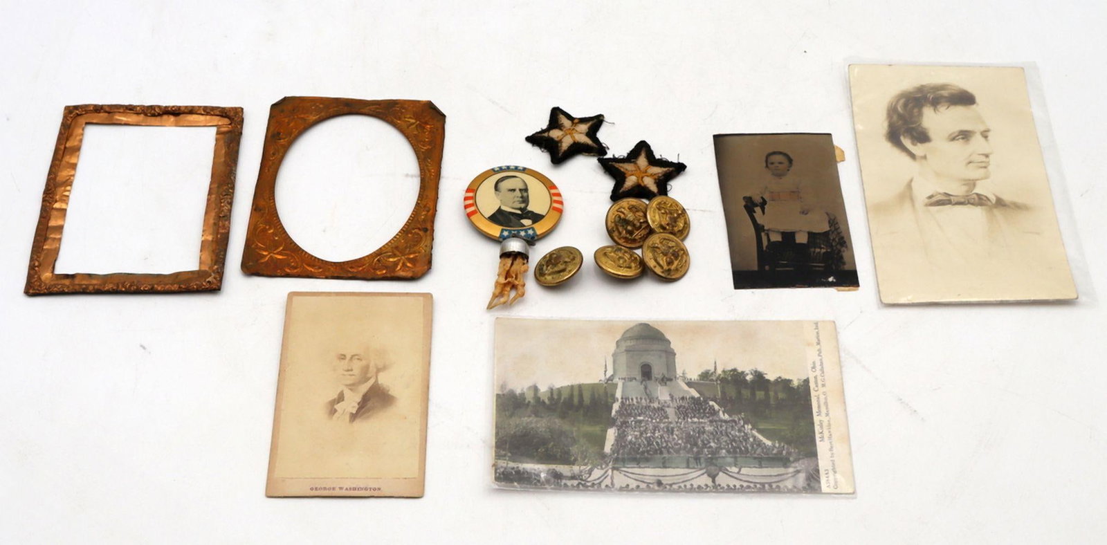 Lot of Americana Memorabilia: American Lot of Americana Memorabilia Mixed materials 19th-20th century A lot comprising assorted Americana items including buttons, early American photographs, and a postcard, representing a range of