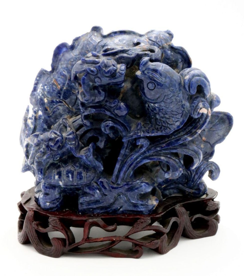 Chinese Hand Carved Sodalite Sculpture: Chinese Hand Carved Sodalite Sculpture Chinese Early 20th Century Measurements: Approximately 5 3/4" H x 6" W (Includes fitted base) A Chinese hand carved sodalite sculpture depicting a koi