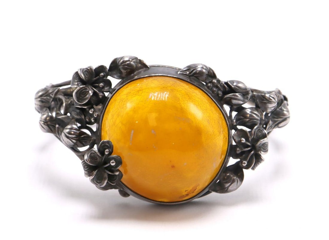 Vintage Sterling Silver & Amber Bangle Bracelet: Vintage Sterling Silver & Amber Bangle Bracelet Sterling Silver and Amber Measurements: approx. 2 3/8" inside across Weight: approx. 1.38 troy oz A vintage sterling silver bangle bracelet acce
