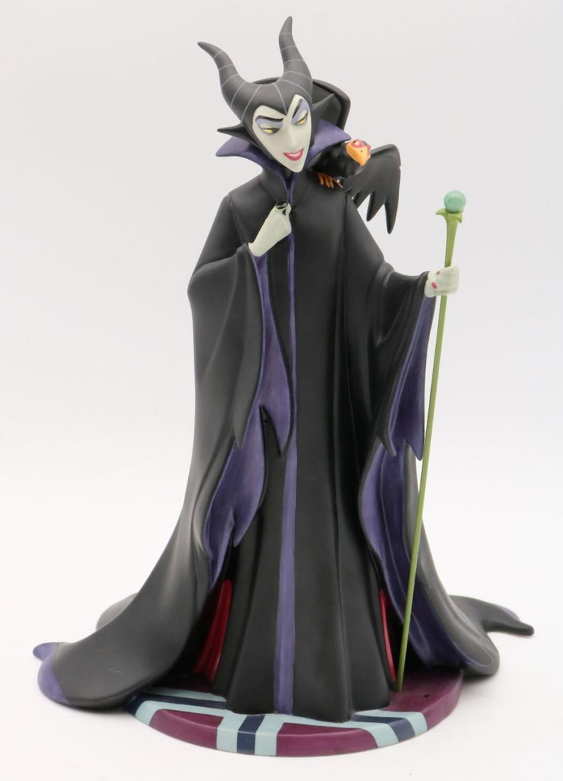 Walt Disney "Evil Enchantress" Maleficent Ceramic Figurine: Walt Disney Classics Collection “Evil Enchantress” Maleficent Ceramic Figurine 10" H x 6 1/2" W x 7" D Box: 11" H x 14" W x 12" D A ceramic figurine titled “E