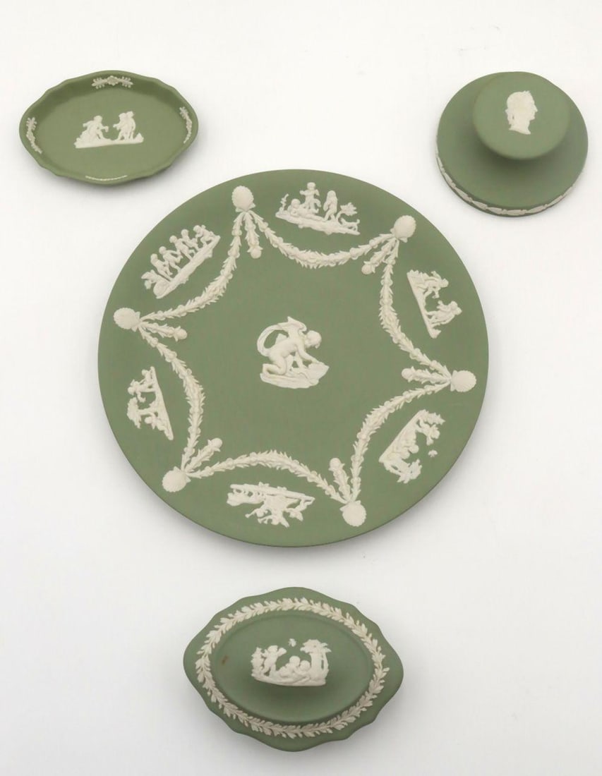 Lot of 4 Wedgwood Green Jasperware Pieces: Wedgwood Green Jasperware Group, Four Pieces English 20th Century 3 1/2" W to 9" W A lot of four Wedgwood green jasperware pieces, including one box, two dishes, and one paperweight, each feat