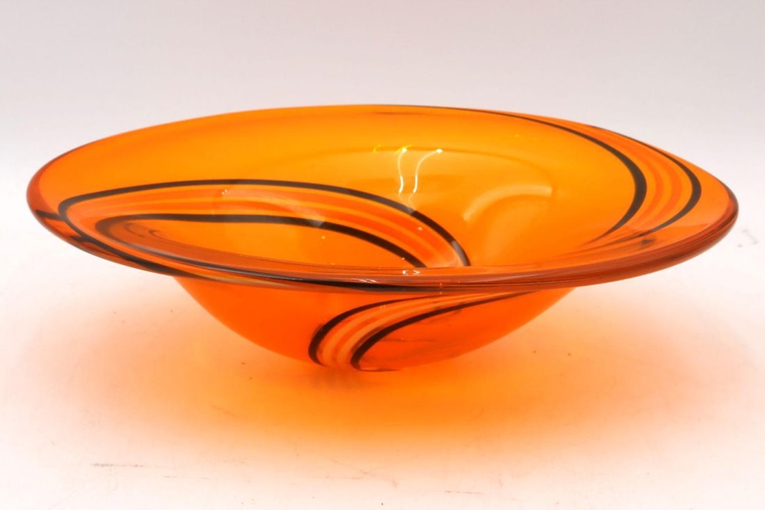 Orange Oval Art Glass Bowl: Orange Oval Art Glass Bowl 11" W x 8" D x 3" H Unsigned art glass bowl of oval form with vibrant orange coloration and a smooth freeform silhouette. Condition is overall good. Have