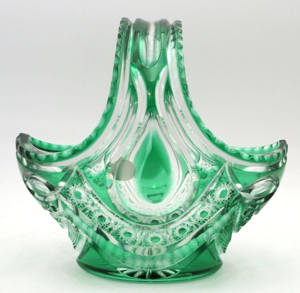 Varga Cut Art Glass Basket: Varga Cut Art Glass Basket 8 1/4" W x 7 1/2" H A cut art glass basket by Varga featuring faceted detailing, a scalloped rim, and an arched handle in a classic basket form. Condition is