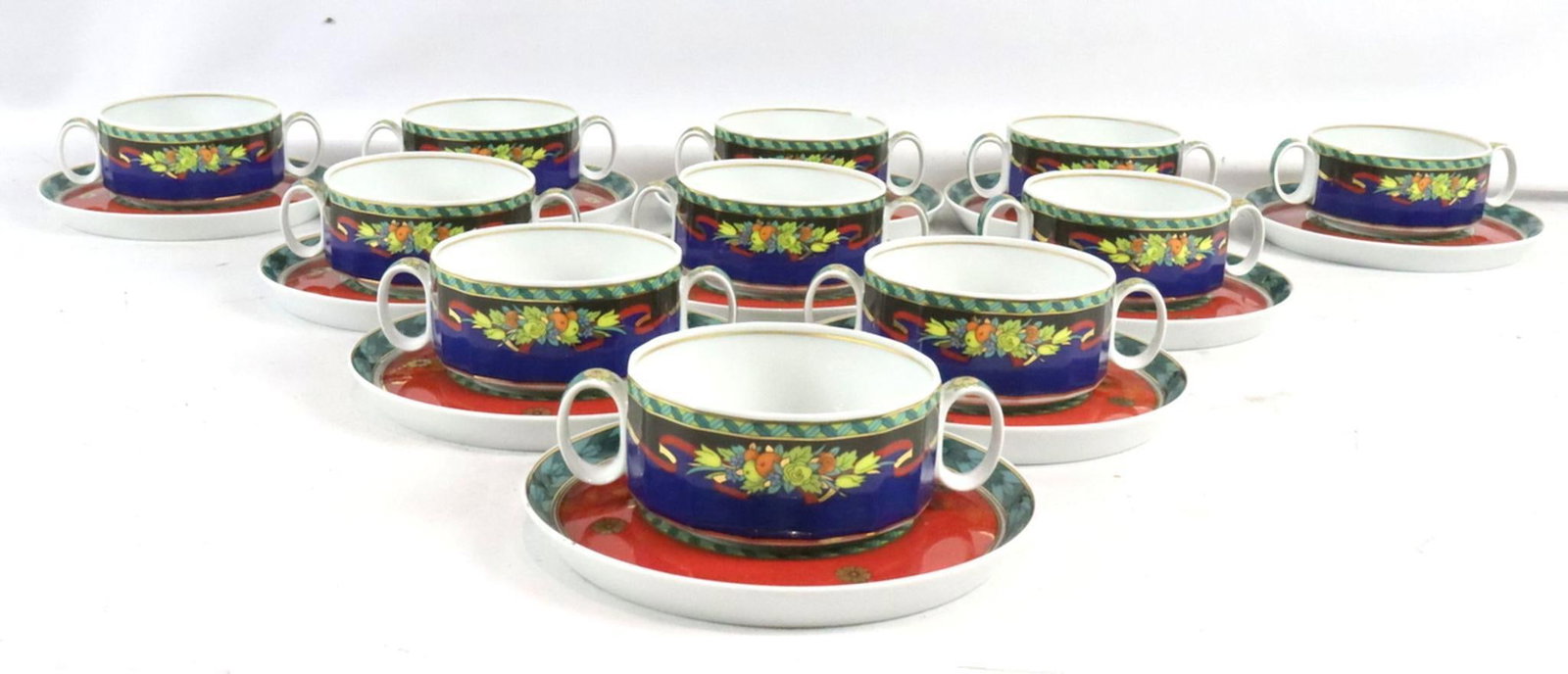 Rosenthal Versace "Le Roi Soleil" Porcelain Cream Soup Cup & Saucer Set: Rosenthal Versace Le Roi Soleil Porcelain Cream Soup Cup & Saucer Set Includes 11 cream soup cups and 11 saucers. Cup measures approx. - 1 3/4” H x 5 1/4” W. Saucer measures approx. - 