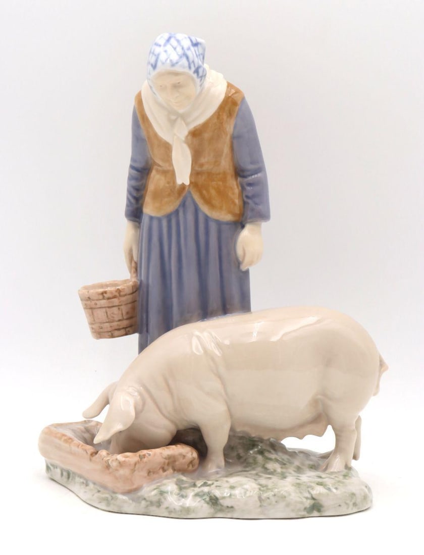 B & G #2237 "Woman with Pig" Hand Painted Porcelain Figurine: Bing & Grøndahl (B & G) #2237 "Woman with Pig" Hand-Painted Porcelain Figurine Denmark 8 1/2" H x 7 1/4" W This hand-painted porcelain figurine depicts a woman holding a p