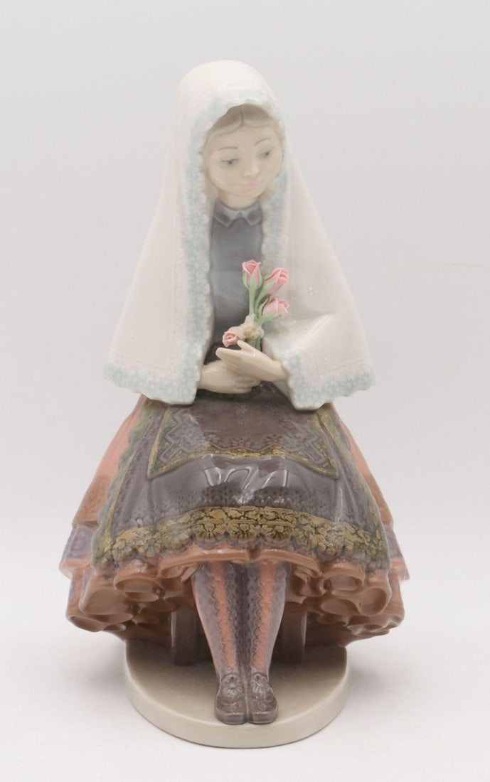 Lladro #5127 "Girl Sitting With Roses" Hand Painted Porcelain Figurine: Lladró (Spanish) #5127 "Girl Sitting With Roses" Hand-Painted Porcelain Figurine 9" H x 6" W x 6 1/2" D Hand-painted porcelain figurine depicting a seated young girl holding r