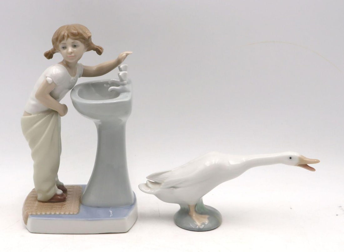 Pair of Lladro Hand Painted Porcelain Figurines: Pair of Lladró Hand-Painted Porcelain Figurines Measurements range from approx. 3 1/4" H x 7" W to 7 1/2" H x 4" W Pair of hand-painted porcelain figurines by Lladró. Feature