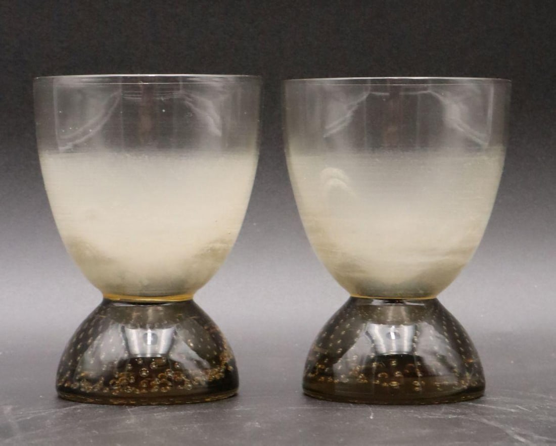 Pair of Glass Bubbled Cups: Pair of Glass Bubble Cups Contemporary Each 3 1/2" H x 2 7/8" Dia. Pair of clear glass cups with controlled bubbles at base. Overall good condition with no chips, cracks, or damages to note. H