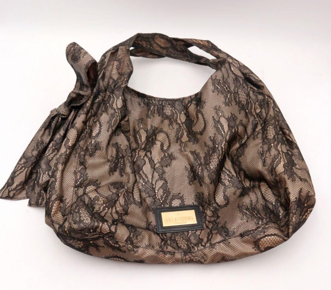 Valentino Garavani "Nuage" Black Lace Nylon Bow Hobo Bag: Valentino Garavani "Nuage" Black Lace Nylon Bow Hobo Bag. 15 1/2" W x 14" H x 3" D. Features a black nylon body with lace overlay, oversized bow detail. Includes dust bag (not orig