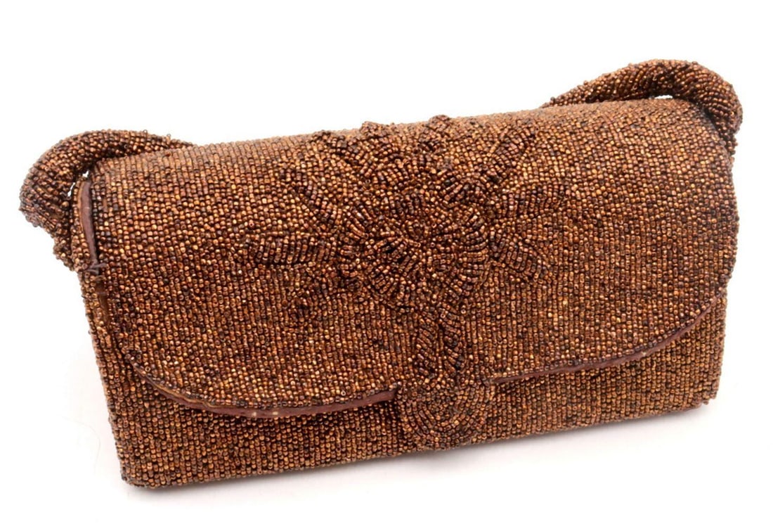 Vintage Beaded Handbag: Vintage Copper Beaded Evening Handbag. Featuring an allover copper-colored beaded exterior with a snap closure. Includes a Coblentz compact mirror. Measures approx. - 3 3/4" H x 8 1/4" W. Cond