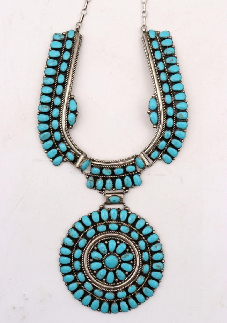 Sterling Silver & Turquoise Native American Medallion Necklace: Native American Sterling Silver & Turquoise Medallion Necklace stamped "Sterling JW" 8" L x 3.875" W; 3.29 troy oz. Condition: Good condition. Have a similar item to sell? Contact 