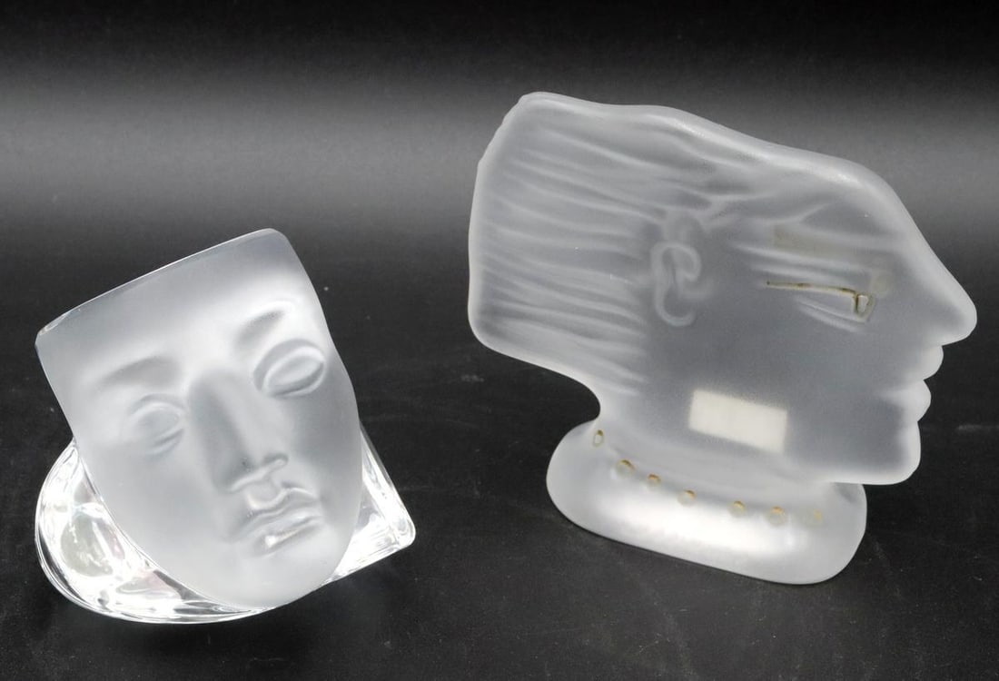 Pair of Daum Crystal Glass Paperweights: Daum (France) Pair of Daum Crystal Glass Paperweights Glass, both signed; one with paper label Including one "Faces" paperweight designed by H. McConnico and one "Abstract Head" paperw