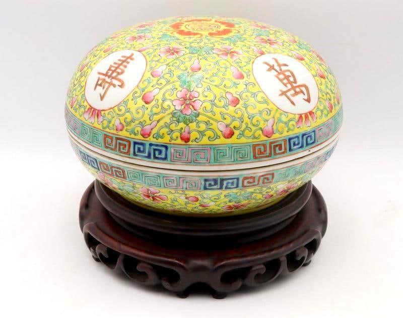 Large Chinese Famille Rose Lidded Bowl and Stand: Chinese Famille Rose Lidded Bowl with Stand Yellow-ground ceramic with carved wood stand, signed Overall: 8.5" H x 10.5" Dia. Condition: Very good condition with no chips, cracks or repairs.