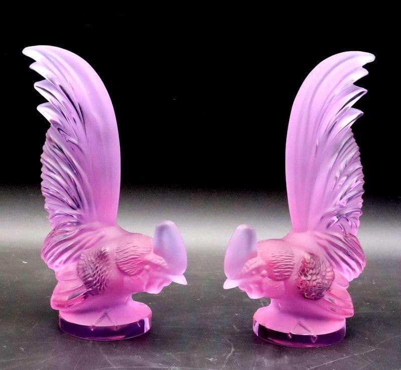 Lalique "Bantam Rooster" Glass Paperweights / Car Mascots, Pair: Lalique (France) "Bantam Rooster" Glass Paperweights / Car Mascots, Pair Glass Each: 8" H x 5.5" W x 2.75" D Both unsigned. Lavender glass exhibiting a blue color under direct lighting. Condition: Ver