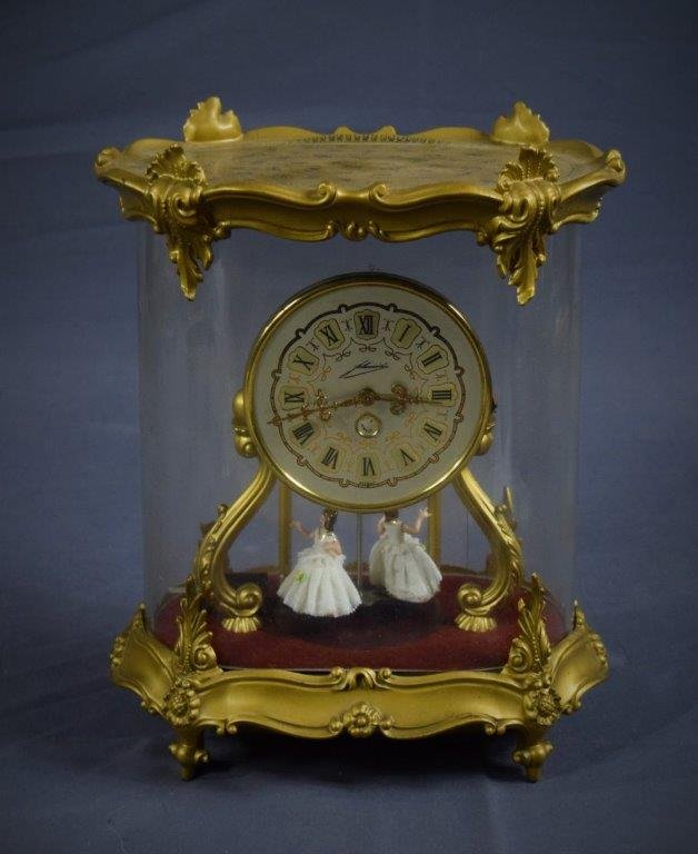 German 7 Jewel W.A. Schmidt Gilt Clock: GERMAN (20TH CENTURY) gilt clock featuring rotating figures (11" x 10")