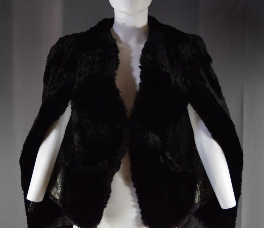 Black Ladies Fur Vest: A vintage black ladies fur vest (15" arm; shoulder to shoulder 17")