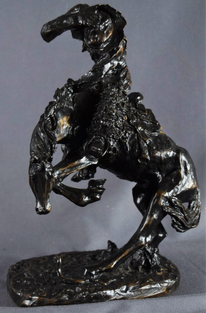 Frederic Remington, Sculpture (Rattlesnake): AMERICAN (20TH CENTURY) A bronze sculpture of a man riding a horse dodging a rattlesnake titled "The Rattlesnake" by Fredric Remington edition number 9500 (9" x 7")