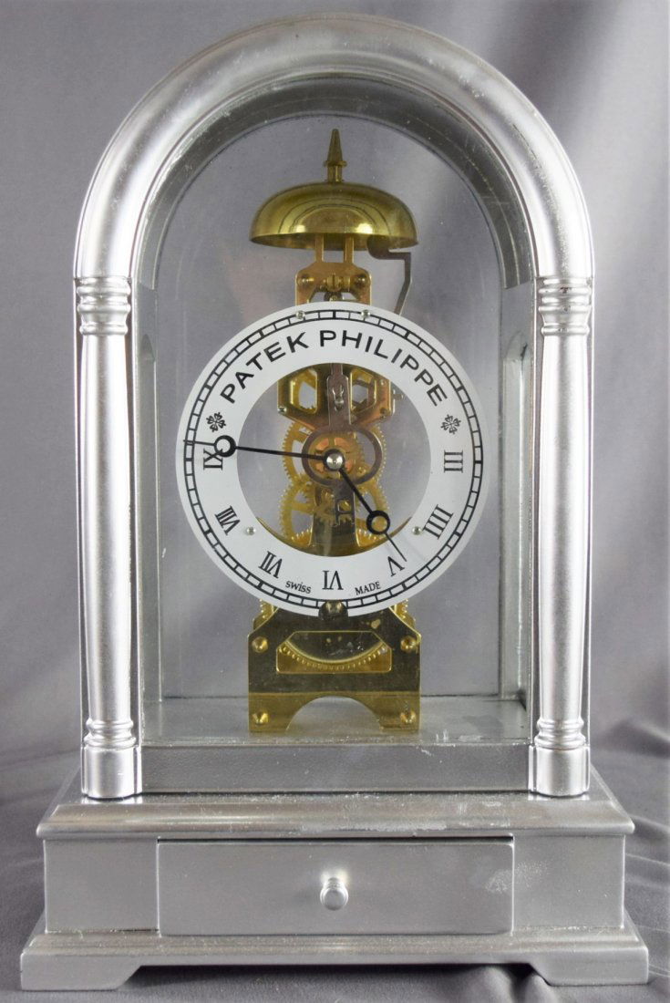 Patek Philippe, Swiss, Geneva (Showroom Clock): (20TH CENTURY) Patek Philippe, showroom clock, glass front, with a silver finish (14" x 9")