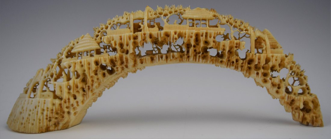 Chinese, Bone Carving Bridge: CHINESE (19TH CENTURY) Carved bone in a bridge form with figures in a landscape 8" x 5"