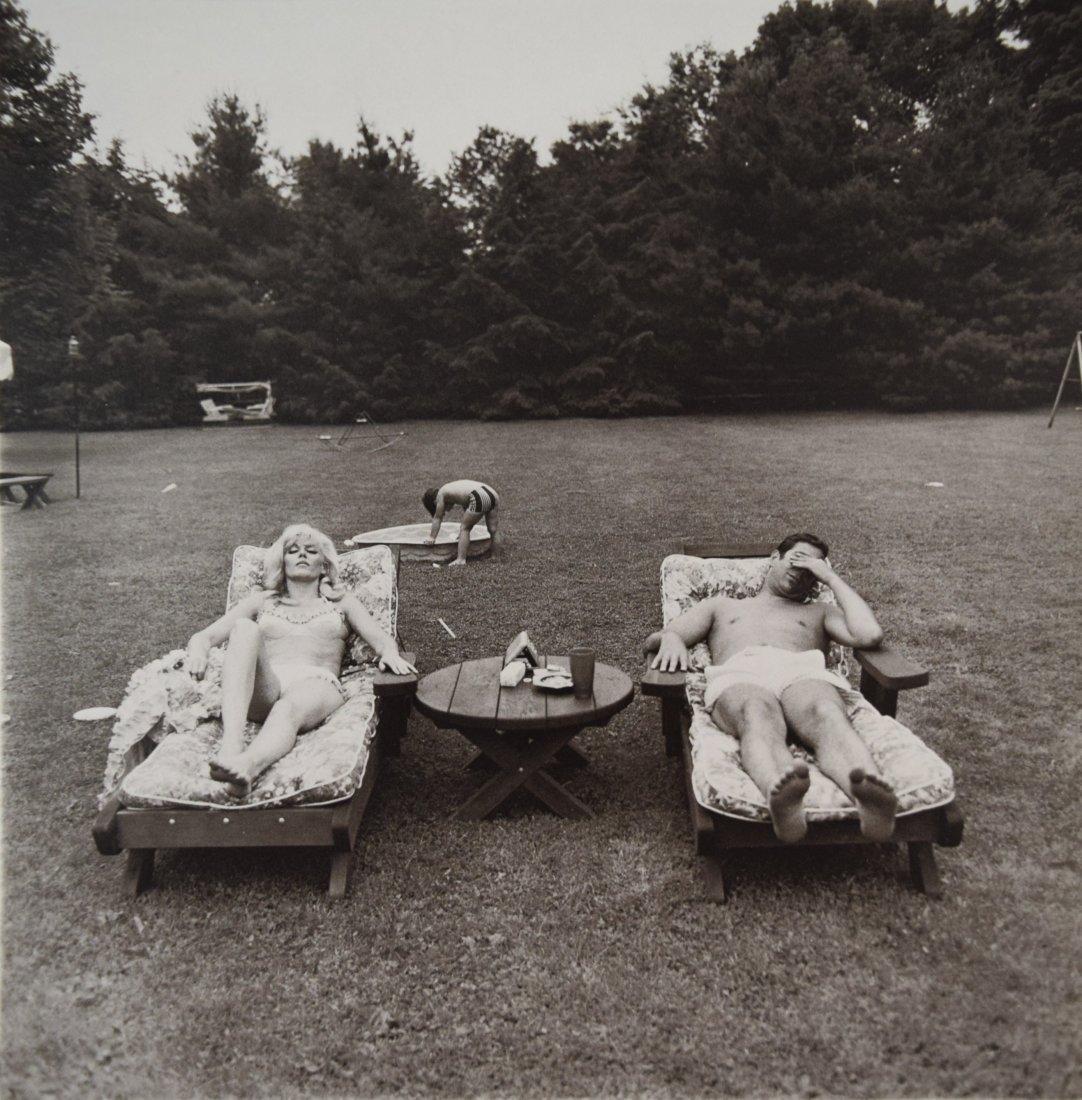 Diane Arbus - A Family On Their Lawn: DIANE ARBUS (1923-1971) A Family On Their Lawn Print in black and white, 1972 Printed in America 8 1/2" x 8 1/2"