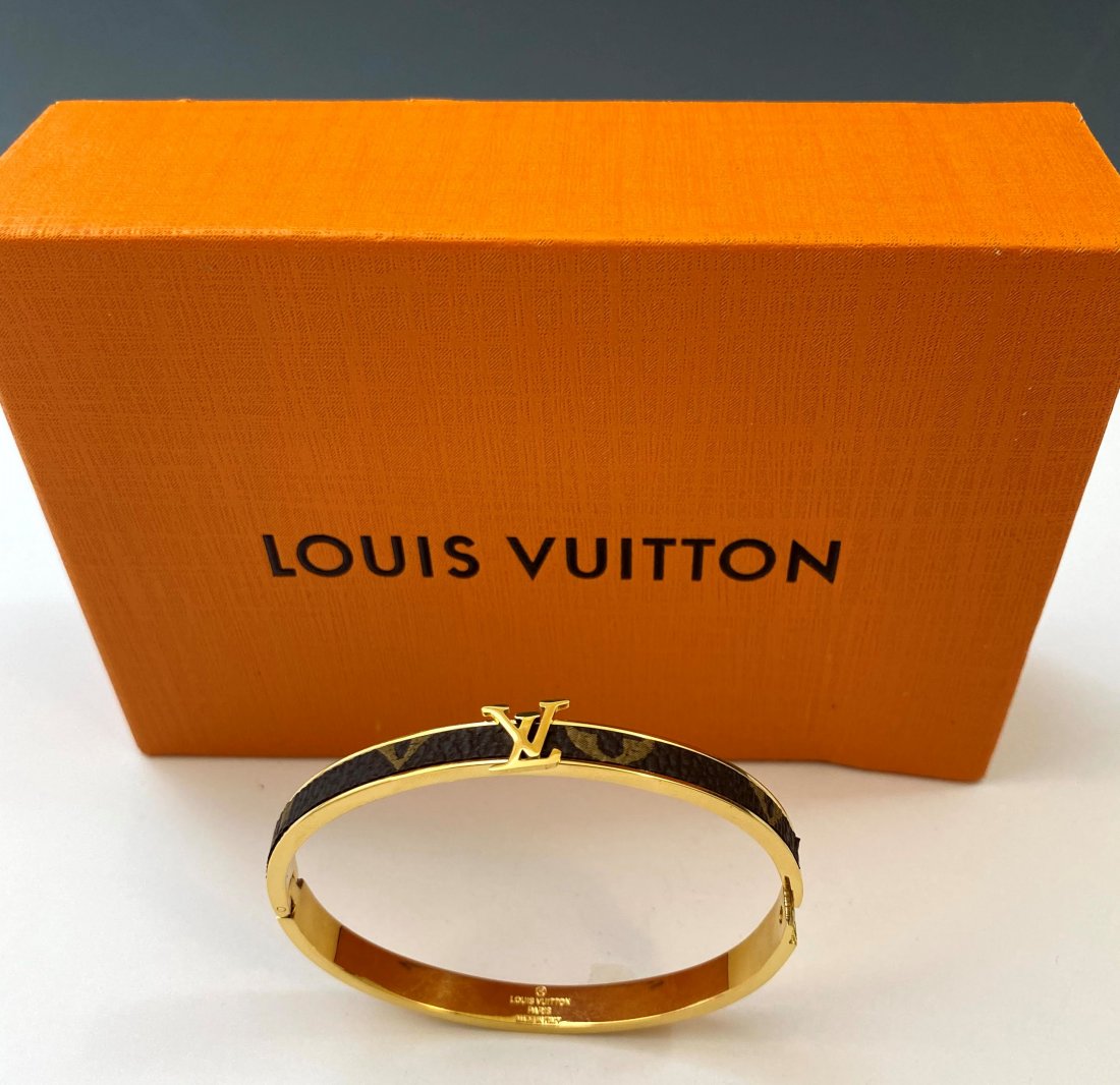 Louis Vuitton Monogrammed Bracelet: LOUIS VUITTON (PARIS) Monogrammed bracelet issued by Louis Vuitton, stamped to backside