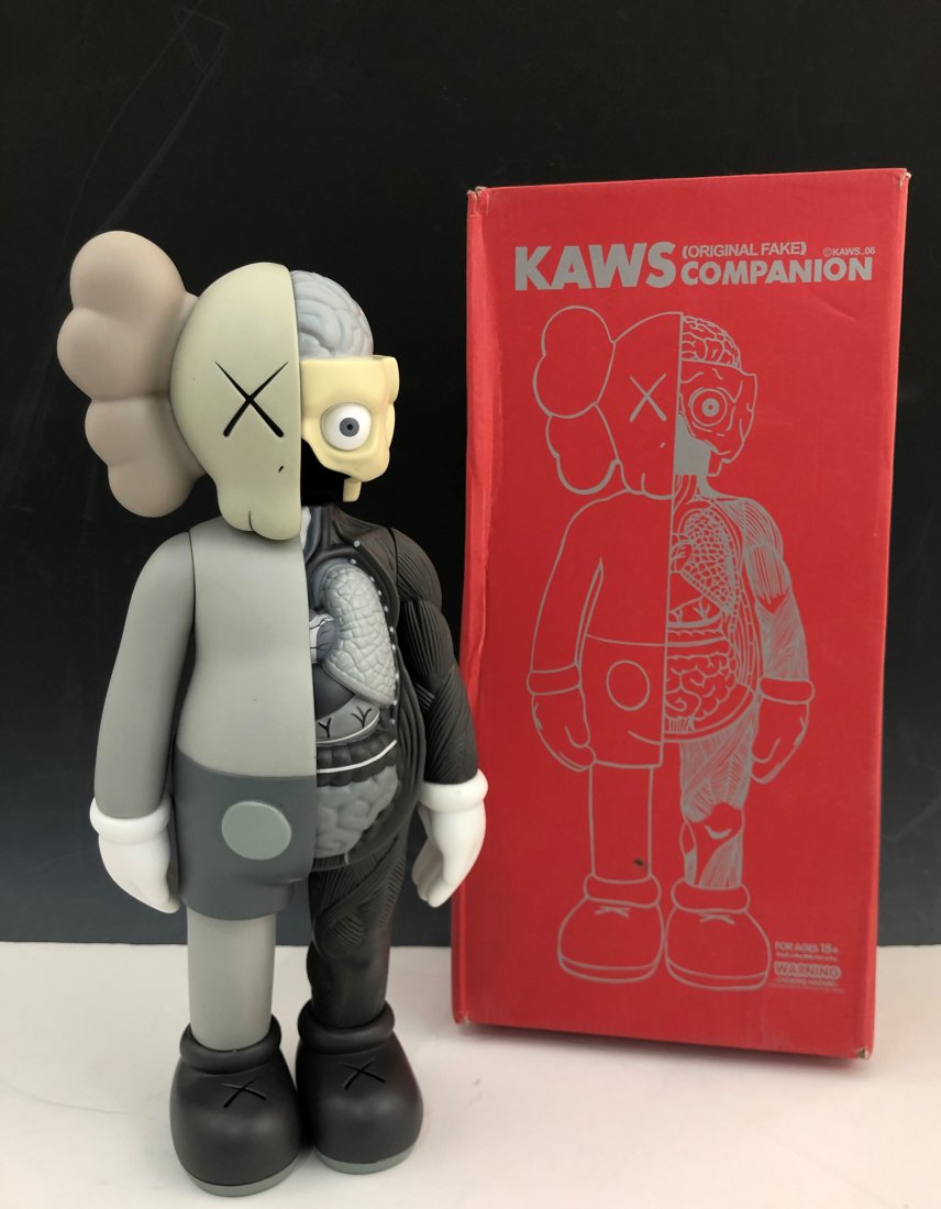 Kaws - Dissected Companion Figure: KAWS (B. 1974) Dissected Companion Painted cast vinyl 14-3/4" x 6-1/4" x 3-1/4" Stamped on the underside of the feet Produced by Medicom Toy and OriginalFake, Tokyo