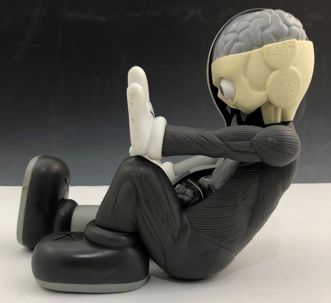 Kaws - Resting Place Companion 2012-2013: KAWS (B. 1974) Resting Place Companion, 2012-13 Painted cast vinyl 8-1/2" x 9" x 11-1/2" Stamped to the underside of the left foot Produced by Medicom Toy and OriginalFake, Tokyo