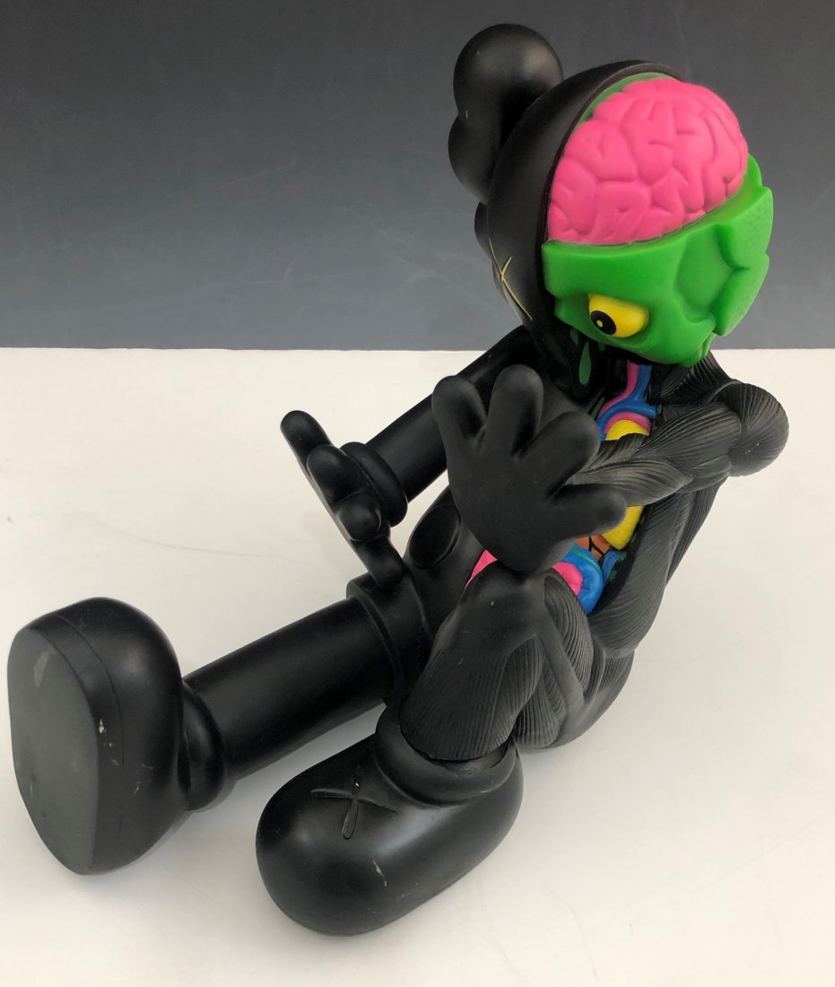 Kaws - Resting Place Companion 2012-2013: KAWS (B. 1974) Resting Place Companion, 2012-13 Painted cast vinyl 8-1/2" x 9" x 11-1/2" Stamped to the underside of the left foot Produced by Medicom Toy and OriginalFake, Tokyo