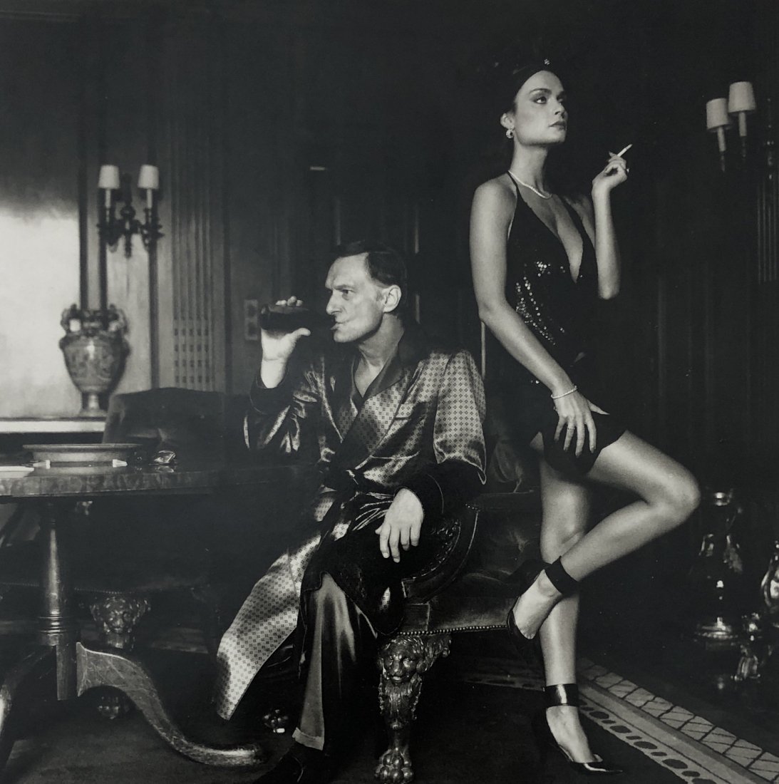 Helmut Newton - Hugh Hefner, Beverly Hills, CA, 1984: HELMUT NEWTON (1920-2004) Hugh Hefner and Carrie Leigh, Beverly Hills, 1984 Photo-litho 7 1/3" x 7 1/3"