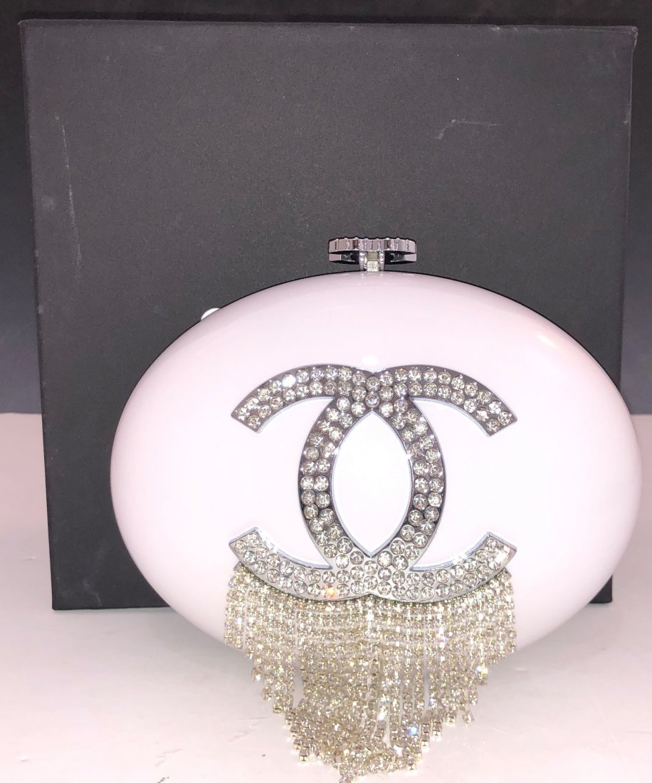 Chanel VIP Plexiglas Double "C" Handbag: CHANEL (PARIS) Plexiglas, egg shape design Chanel VIP double "C" bag with hanging metal strands 8" x 4"