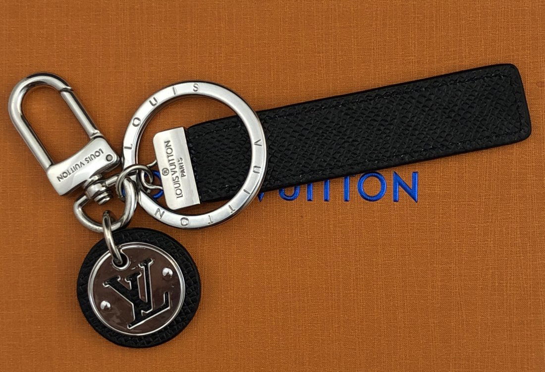 Louis Vuitton Black Leather Keychain: LOUIS VUITTON (PARIS) Black leather keychain with stamped ring, issued by Louis Vuitton with box