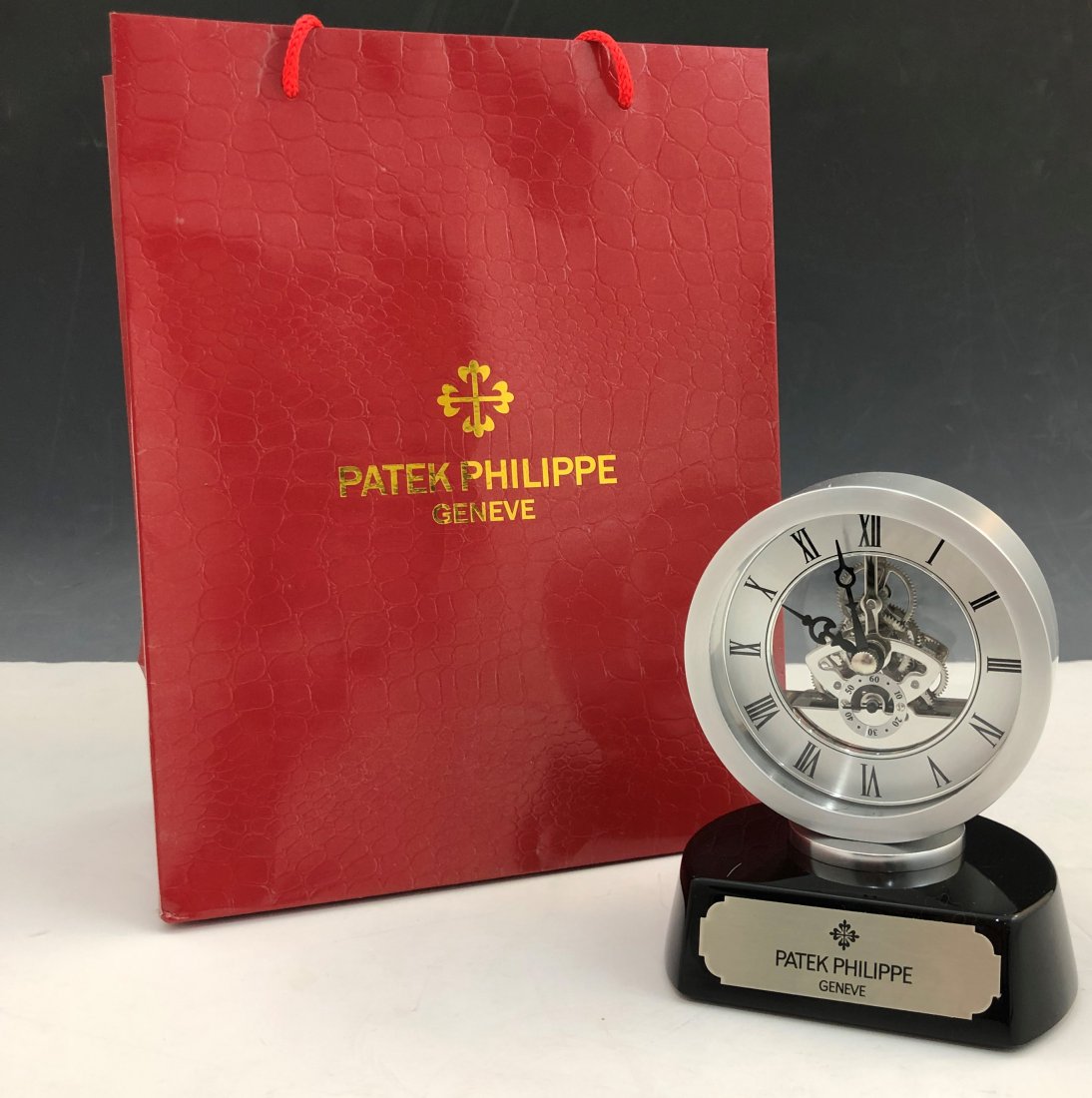 Patek Philippe Showroom Dealer Clock: PATEK PHILIPPE (SWISS) Showroom dealer metal clock, Patek Philippe with plaque; unstamped movement 5 1/4" x 3 1/2"