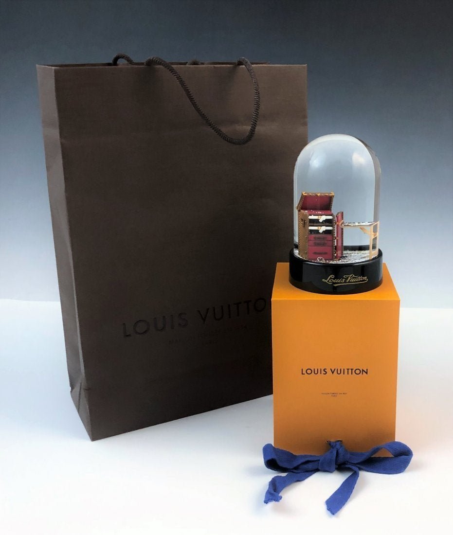 Louis Vuitton Snow Globe: LOUIS VUITTON (PARIS) Snow Globe issued by Louis Vuitton 4" X 5", box and bag included