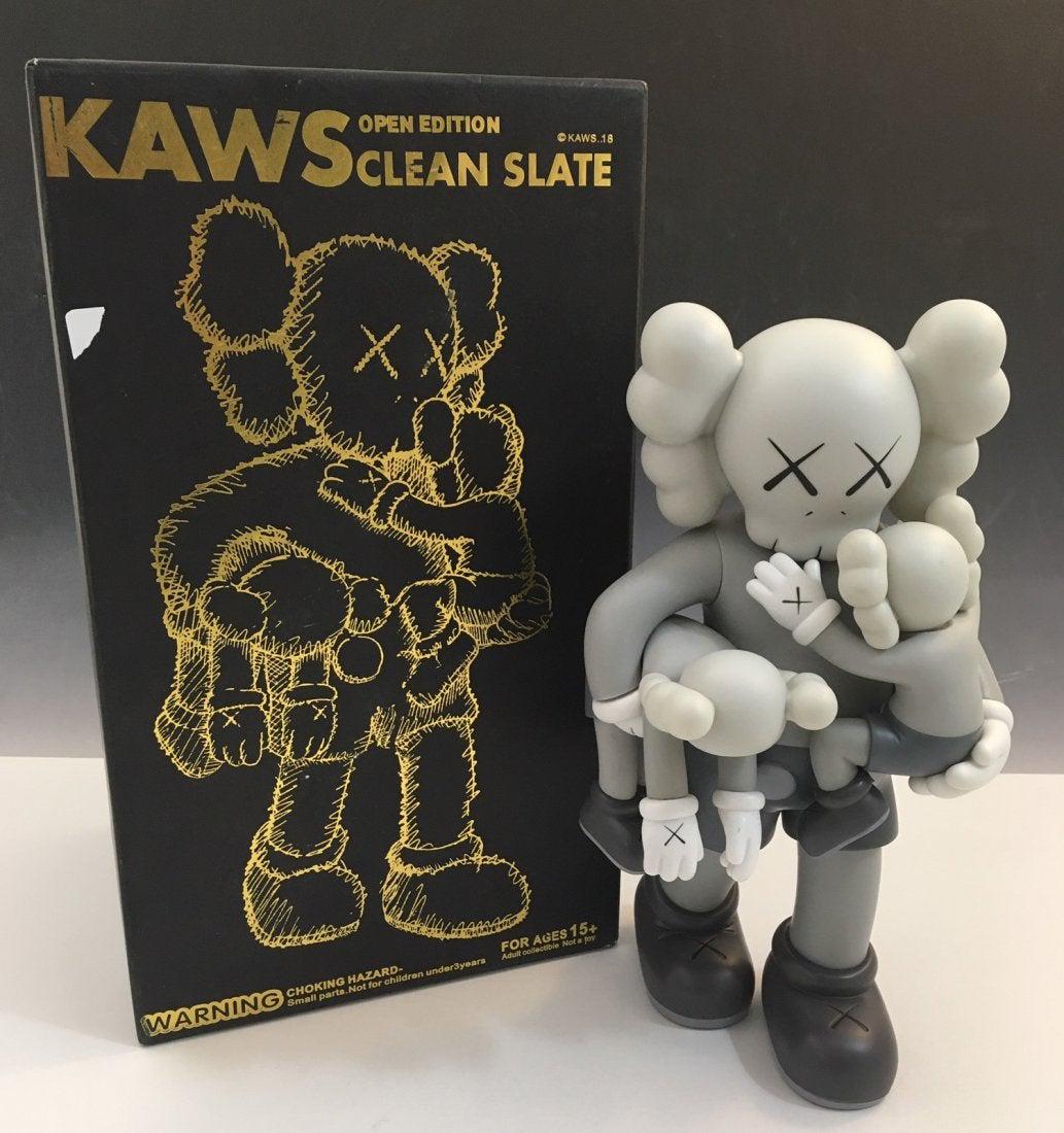 Kaws - Clean Slate (Grey) Open Edition 2018: KAWS (B. 1974) Clean Slate, 2018 Painted cast vinyl 14" x 8" x 8" Open Edition Stamped to the underside of the feet Produced by Medicom Toy, Tokyo