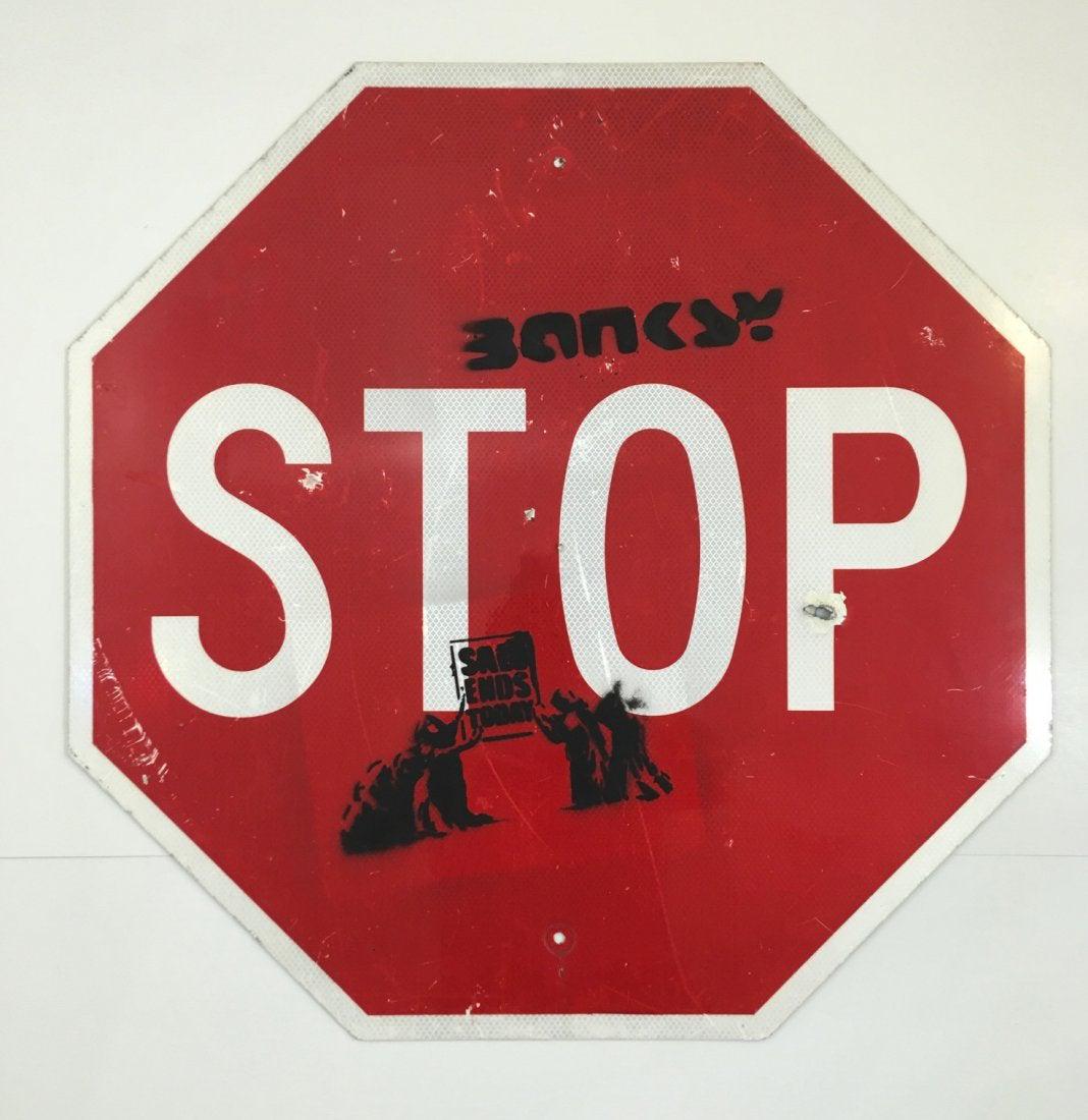 Banksy - Spray Paint Graffiti Rat Stop Sign: ATTRIBUTED TO BANKSY (BRITISH) Stop Sign Spray paint on metal sign 24 1/2" x 24 1 2/" Signed upper right side