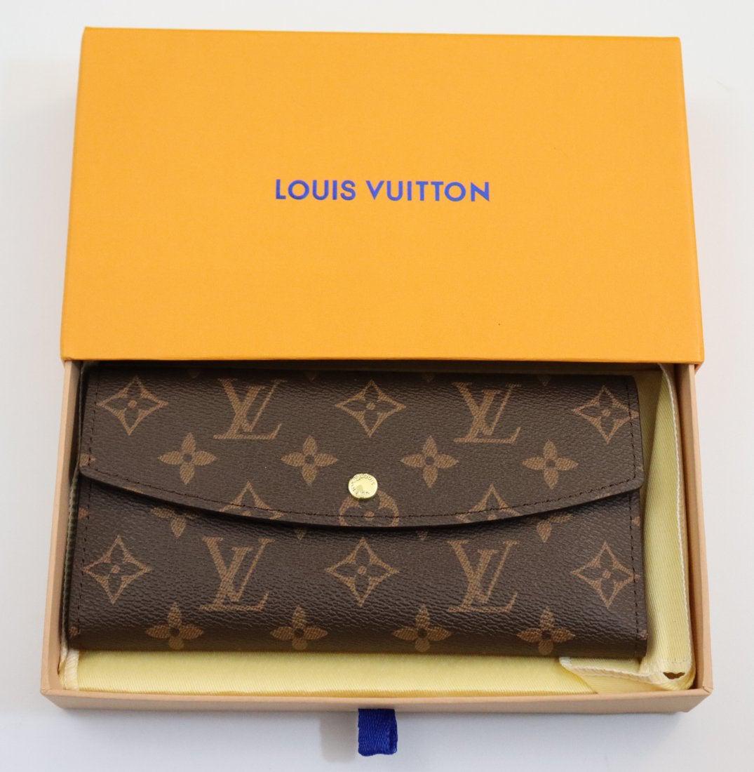Louis Vuitton Monogram Long Wallet: LOUIS VUITTON (PARIS) Monogram long wallet issued by Louis Vuitton with box; wallet: 4" x 7 1/2"