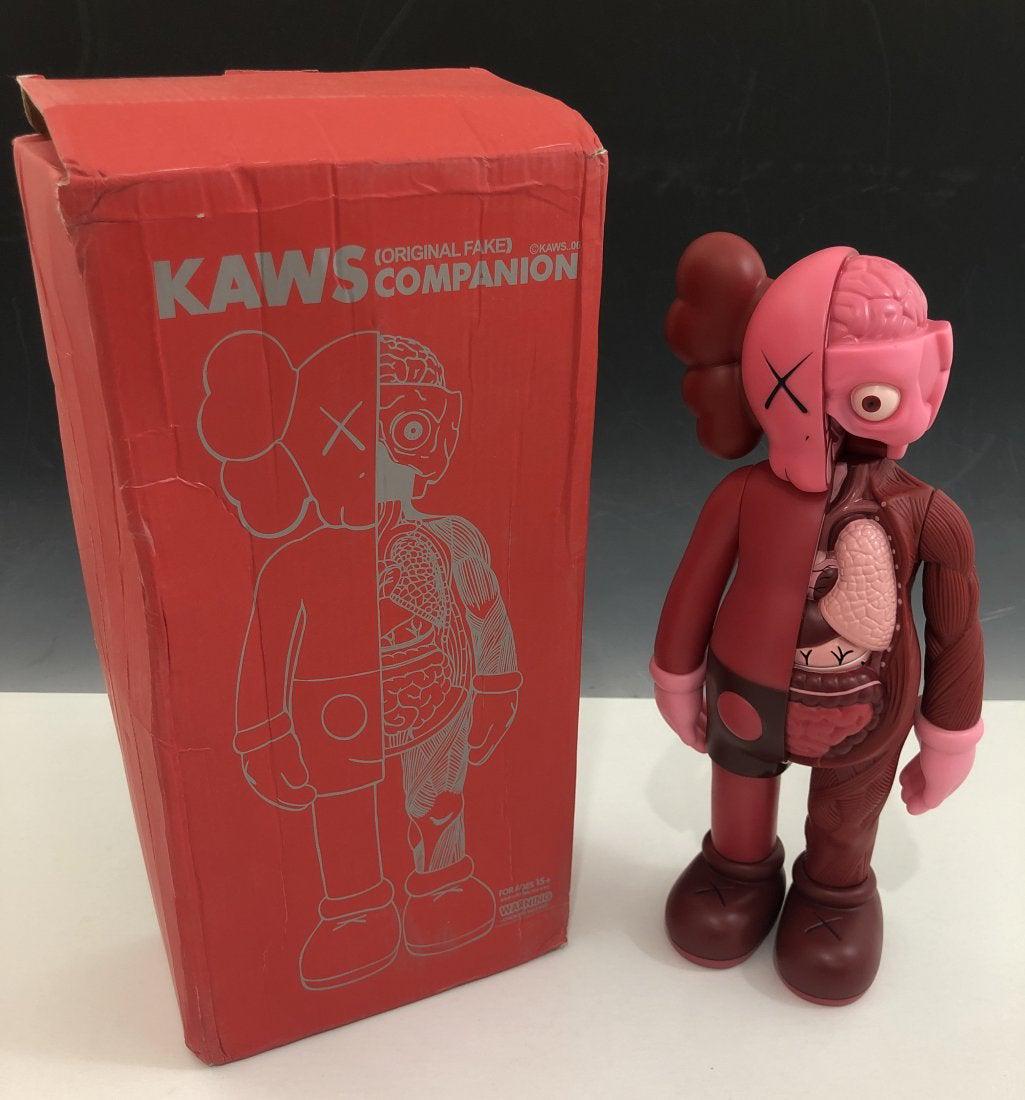 Kaws - Dissected Companion Figure: KAWS (B. 1974) Dissected Companion Painted cast vinyl 14-3/4" x 6-1/4" x 3-1/4" Stamped on the underside of the feet Produced by Medicom Toy and OriginalFake, Tokyo