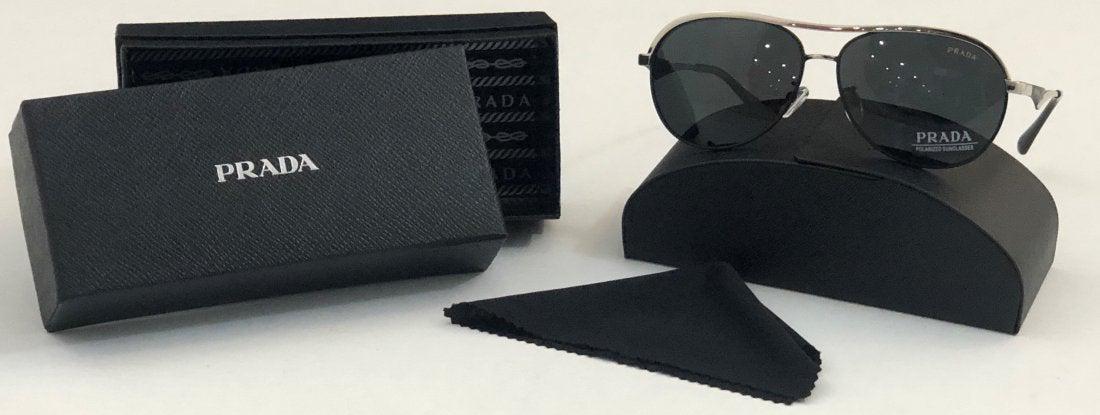 Prada Sunglasses: PRADA (ITALIAN) Sunglasses issued by Prada with box and cloth