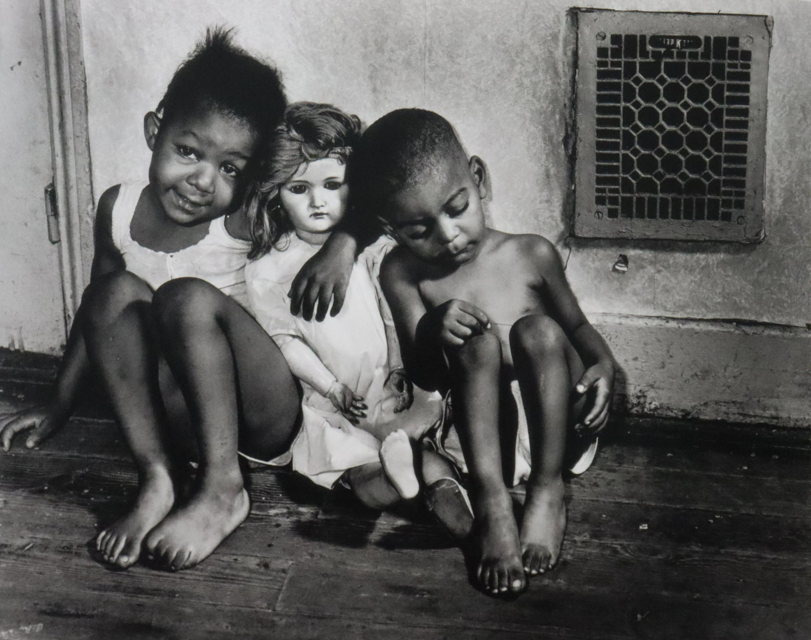 Gordon Parks - Children with Doll, Photo-Litho: GORDON PARKS - (1912-2006) Children with Doll, Washington, D.C. Photo-Litho Printed later 20th Century 6 1/4" x 8" (Image Size)