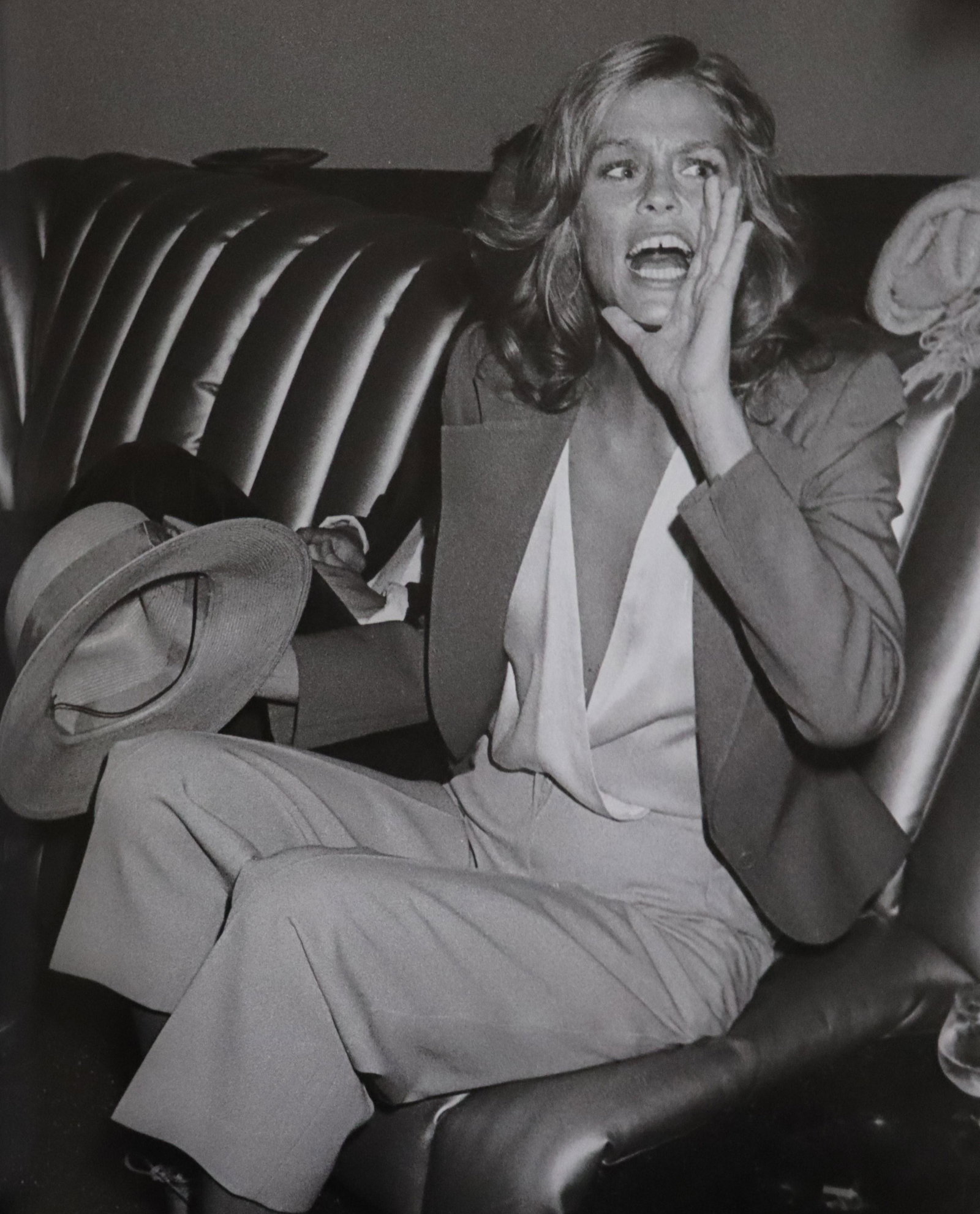 Lauren Hutton, Studio 54, Photo-Litho: UNKNOWN PHOTOGRAPHER Lauren Hutton on the new, vertical banquettes, Studio 54 Photo-Litho Printed circa late 20th century 13 5/8" x 11 1/4" (Image Size)