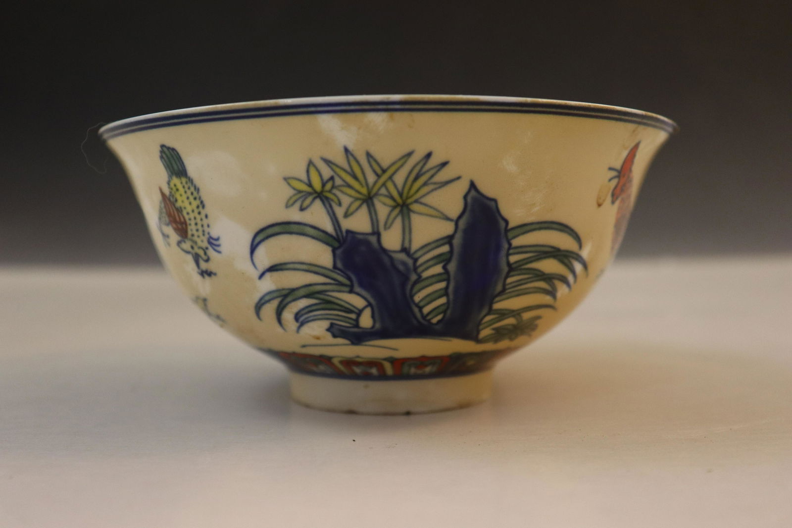 Chinese Rooster Motif Bowl (Museum Sticker): Bowl decorated in blue, red, green, blue with a hen and a floral design. The edge with a double blue line and a four-character seal mark to to the bottom, height of 2 1/2" x diameter of 5 1/4"