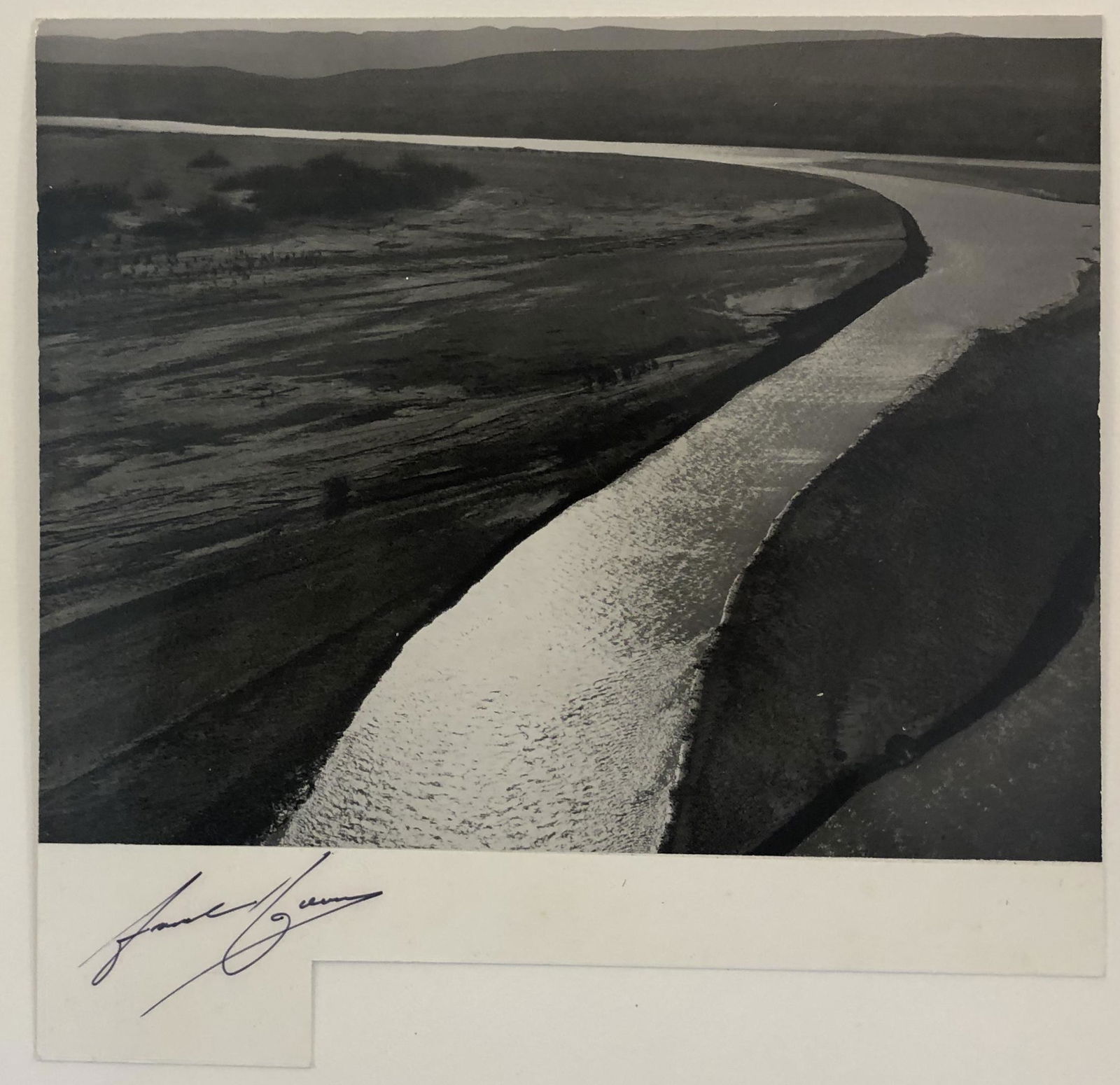 Ansel Adams - Big Bend National Park, Texas Hand Signed: ANSEL ADAMS (B.1902-1984) The Rio Grande, from Boquillas, Big Bend National Park, Texas Hand Signed bottom left corner Black and white photo on glossy paper 9" x 7 1/2" Printed second half of 20th Cen