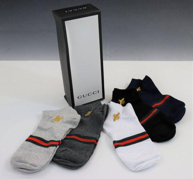 Grouping of 5 Gucci Socks: Grouping of socks issued by Gucci with box