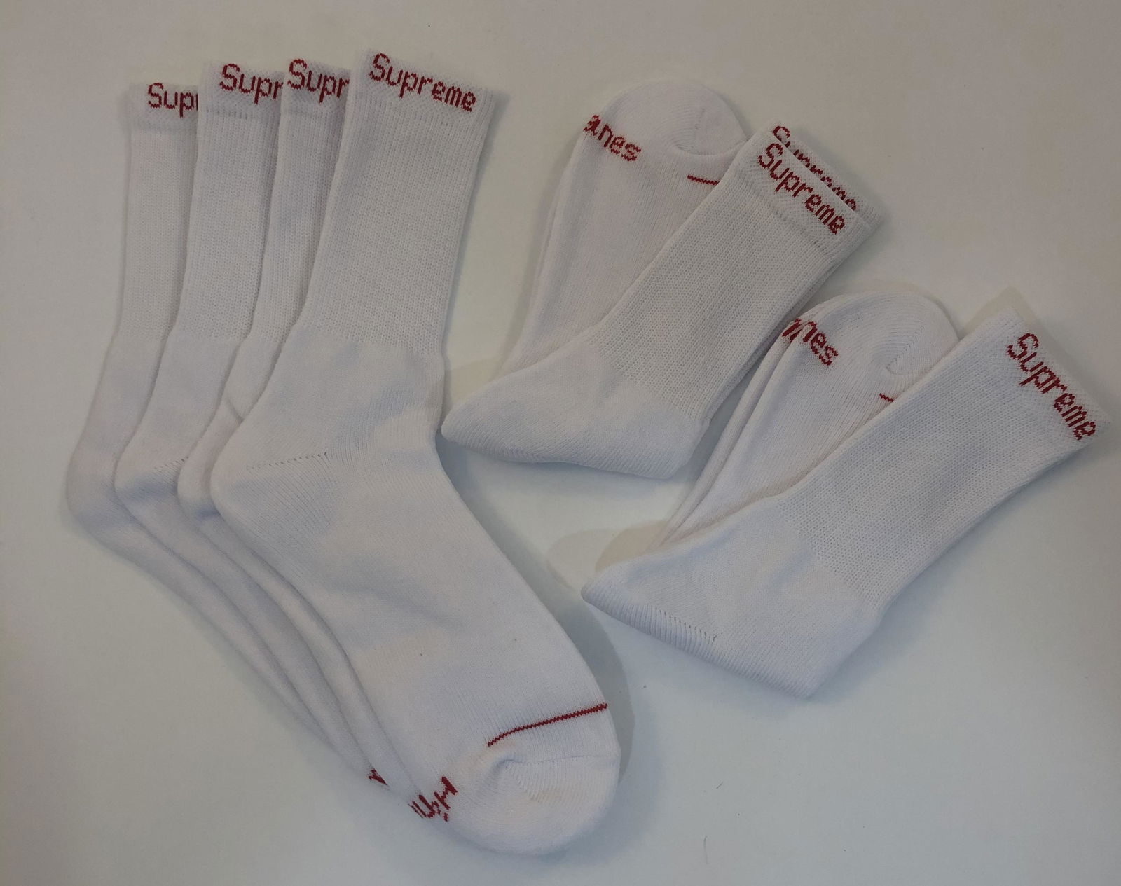 Supreme Cushion Crew Socks: SUPREME Cushion Crew Socks issued by Supreme Total of 4 pairs in white.